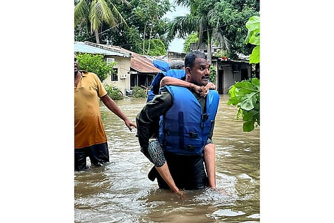 Gujarat Rains: A stranded person being rescued at flood-hit Vadodara
